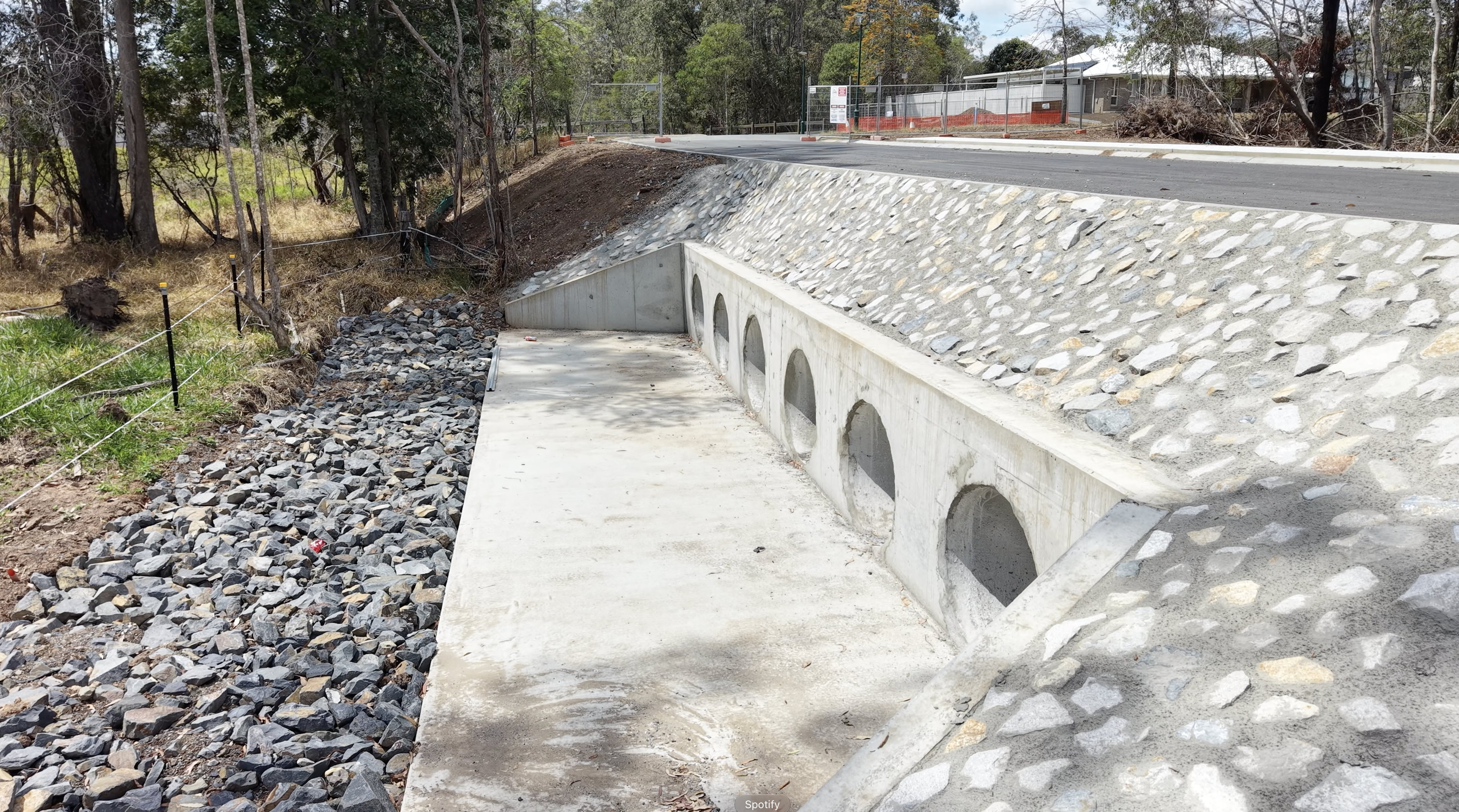 Section of kerb and channel beside a reinforced footpath slab