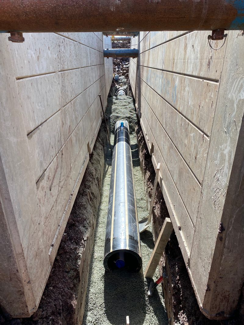 Section through a sewer manhole with inlet and outlet pipes